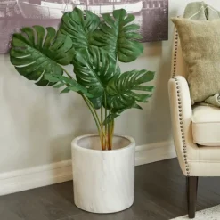Kirkland's Home Monstera Plant In Ribbed Rock Planter- Trees & Topiaries