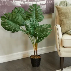 Kirkland's Home Monstera Plant In Ribbed Rock Planter- Trees & Topiaries